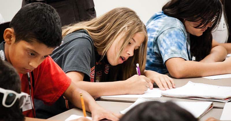 Students writing furiously